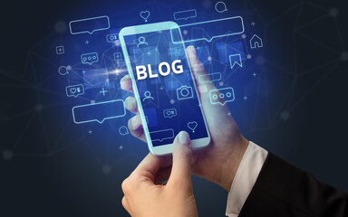 Hand using smartphone with social media concept