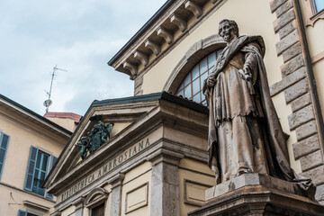 Statue of the cardinal and Archbishop of Milan Federico Borromeo in front of the the Biblioteca...