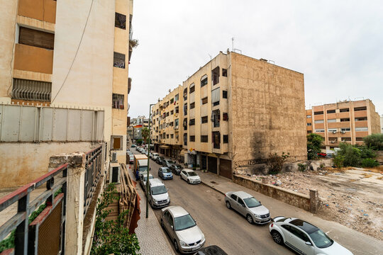 Cars parked on parallel on both sides of the road in Morocco