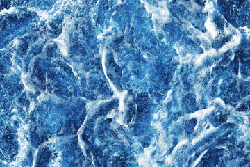 Fototapeta na wymiar Ocean wave background. Bubble water backdrop. Turbulent sea texture. Messy water flow. Depth of the sea. Water foam surface backdrop.