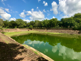 Anuradhapura, Sri Lanka, November 2019 - A large green landscape with a body of water