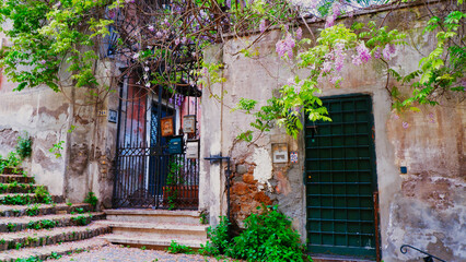 Fototapeta na wymiar View of old narrow street in Rome, Italy