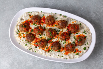Traditional Turkish food; Meatballs on eggplant puree prepared with yogurt. local name; Alinazik kebab. Turkish name; Kofteli Alinazik kebabi