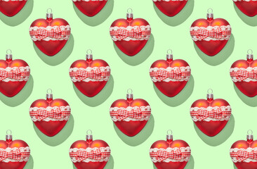 Pattern of christmas heart on green pastel background