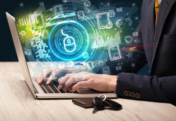 Business hand typing on a modern laptop