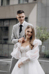 Beautiful, young couple having wedding photoshoot outdoors.