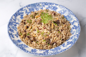 Traditional delicious Turkish food; rice pilaf with pine nuts and currants (Turkish name; ic pilav...