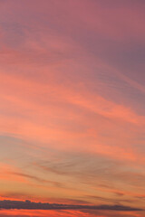 Sunrise, sunset, pink violet orange blue sky with colorful clouds in sunlight background texture	
