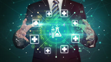 Hand holding healthcare icons concept