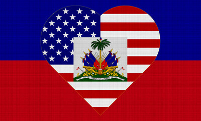 USA and Haiti flag on fabric texture. The concept of cooperation between the two countries.