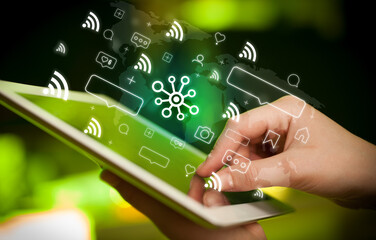 Close-up of a hand using tablet, social media concept