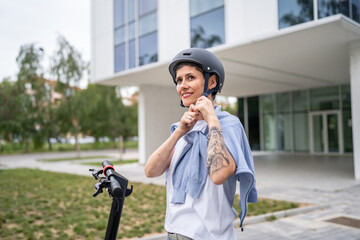 one woman mature senior female putting on safety protective helmet