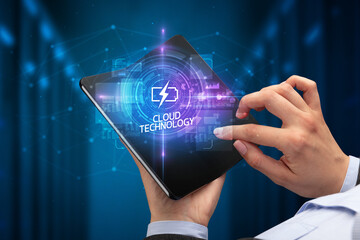 Businessman holding a foldable smartphone, technology concept