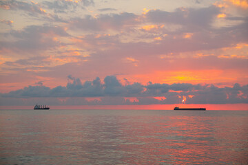 Picturesque view of sunset with clouds over sea