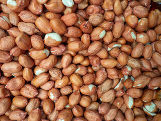 Lots of peanuts. Background from peanut without shell. Snack on the table. Squirrel food. Lots of nuts. Hearty ingredient. Tasty food. Counter in the market.