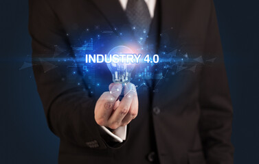 Businessman holding a light bulb