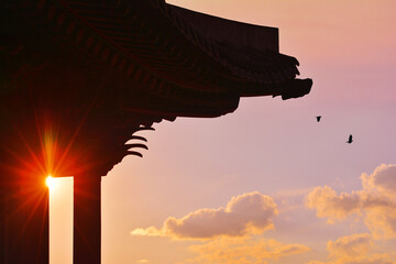 Eaves silhouette of a hanok at sunset,
해질무렵의 한옥의 처마 실루엣