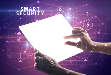 Holding futuristic tablet, security concept