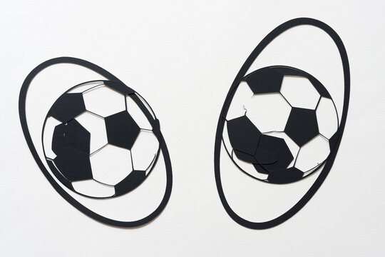 soccer ball glyph or dingbat cutout and arranged inside oval rings on white background