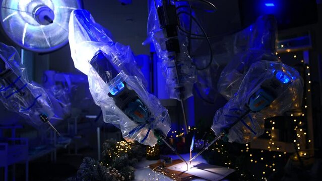 Futuristic robot covered with plastic in dark modern surgery room. Technologically precise equipment writing on paper with a writing pen. Garlands at the table.
