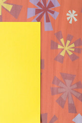 yellow paper box or frame and tissue paper with stars or astral patterns