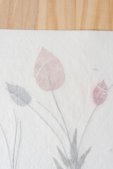 wood background and paper with flowers