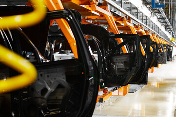 Automated car assembling conveyor at production plant