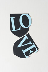 the letters LO and VE placed on shield shaped objects