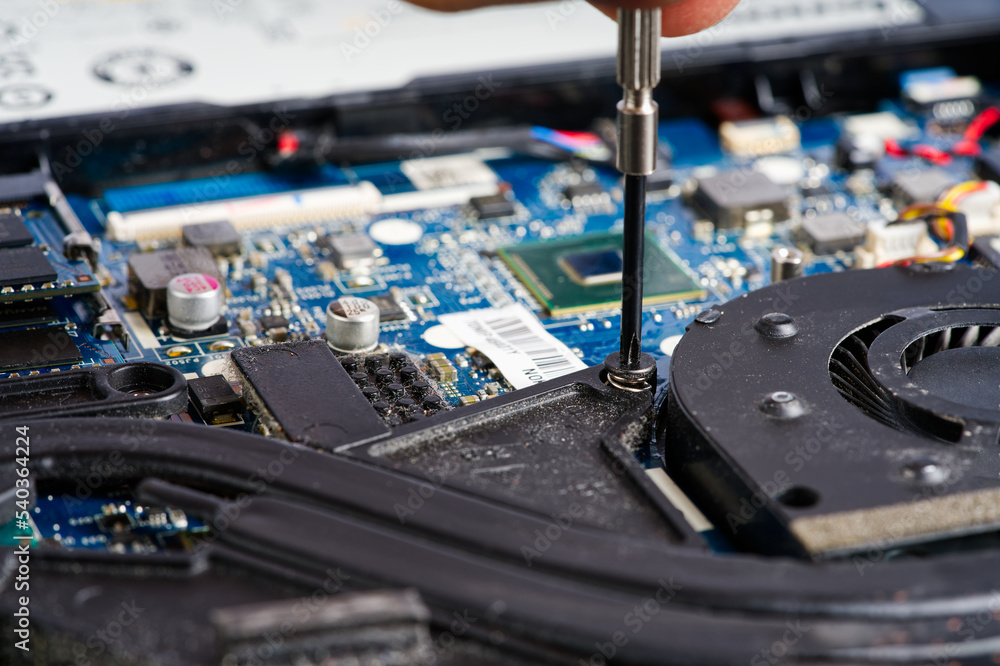 Poster notebook repair. man disassembles a laptop. removes the keyboard. computer service and repair concep