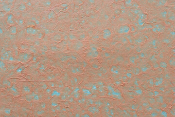 background with orange tissue paper and blue paper beneath