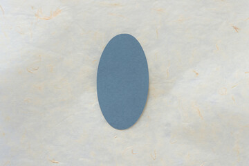 simple oval frame on alabaster-like tissue paper background