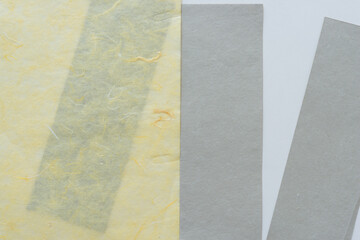 Fototapeta premium background with tissue paper and gray paper stripes