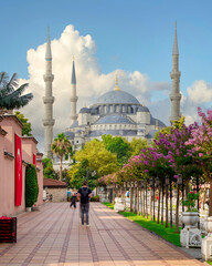 Blue Mosque, or Sultan Ahmet Mosque at crowded Sultan Ahmed square, in a summer day with tourists...