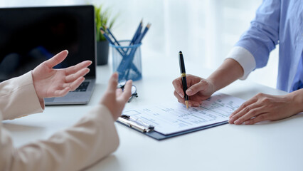Graduates fill out the human Resources department application form and prepare personal document...