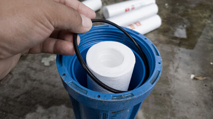 The man hold the Oring Seal of the water filter catridge. process change water filter catridge.