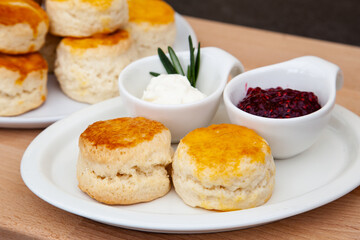 Homemade British Scones with clotted cream and raspberry jam 