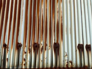 A rusty tin wall near the sea