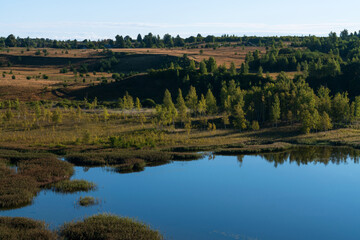View of the Izborsko-Malskaya Valley and Gorodishchenskoe Lake on a sunny summer day, Izborsk, Pechersk district, Pskov region, Russia