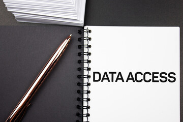 Naklejka premium ACCESS TO DATA - text on a notepad next to a pen. Concept of pass or permission to access data.