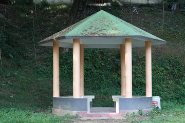 A pavilion or gazebo in a beautiful public garden park
