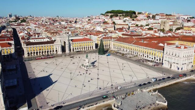 Lisbon, Portugal; Aerial drone footage of the famous commerce square, the pracia do comercio, in Lisbon historic city center by the Tage river in Portugal capital city. Shot with a backward motion. 