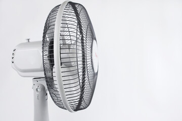 The top of the table top fan is guard, propeller or blade and motor housing, side view, isolated on...