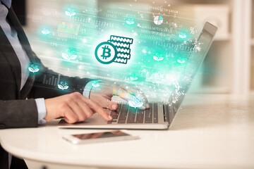 Young man watching stock market on laptop