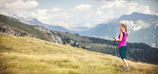 Young woman hiking in the mountains