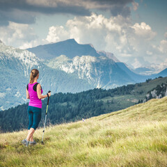 Fototapeta premium Young woman hiking in the mountains