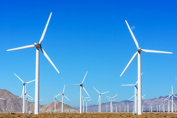 Wind turbine farm for renewal energy at San Gorgonio Pass from Indian Canyon Road near Palm Springs, California, USA