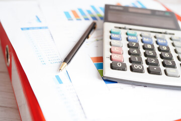 Pen on chart or graph paper. Financial, account, statistics and business data concept.