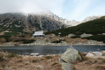 Valley of Five Polish Ponds in Polish High tatras most beautiful Place on earth. Wooden building of   watchtower of TPN. Carpathians, Poland © Iwona