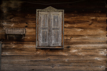 Croatia, October 20,2022 : Rustic style aged window at rural home wall.
