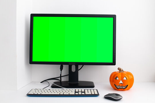 Chroma Key Mock-up On Computer In The White Home Interior. Pumpkin On The Table